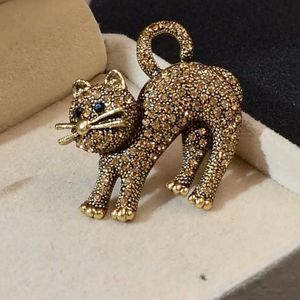 Cat pin brooch with rhinestones.